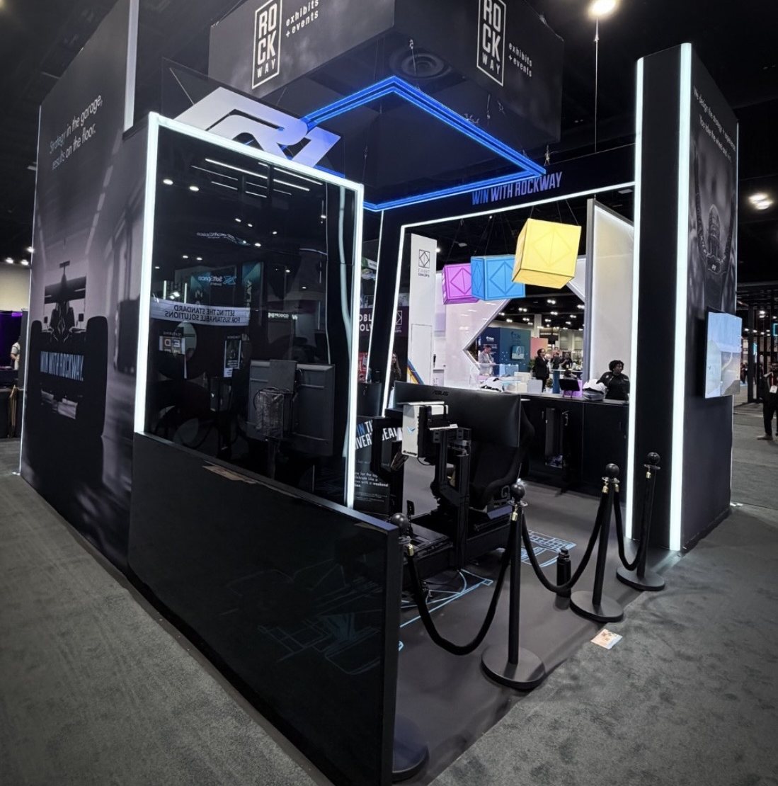 Branded Academy Sim Racing exhibit booth at a trade show
